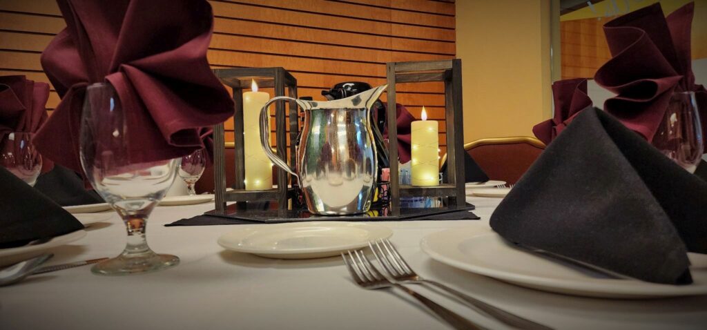 Metal water pitcher on banquet table